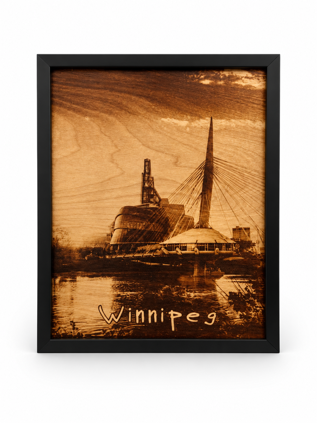 🌉 Winnipeg Skyline – Burned Wood Wall Art in a black frame on a white studio background
